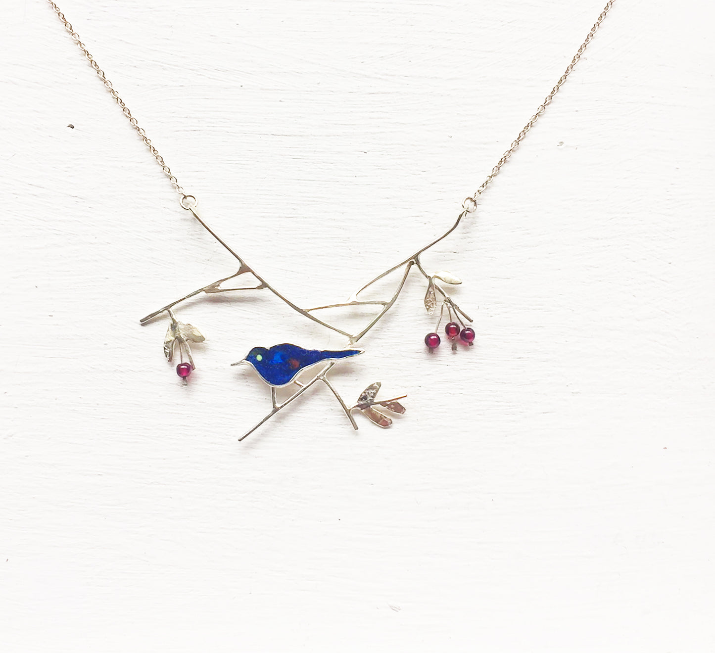 Blackbird with elderberries necklace