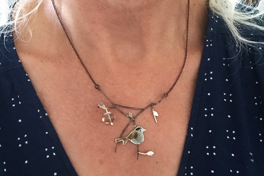 Blackcap with crab apple necklace