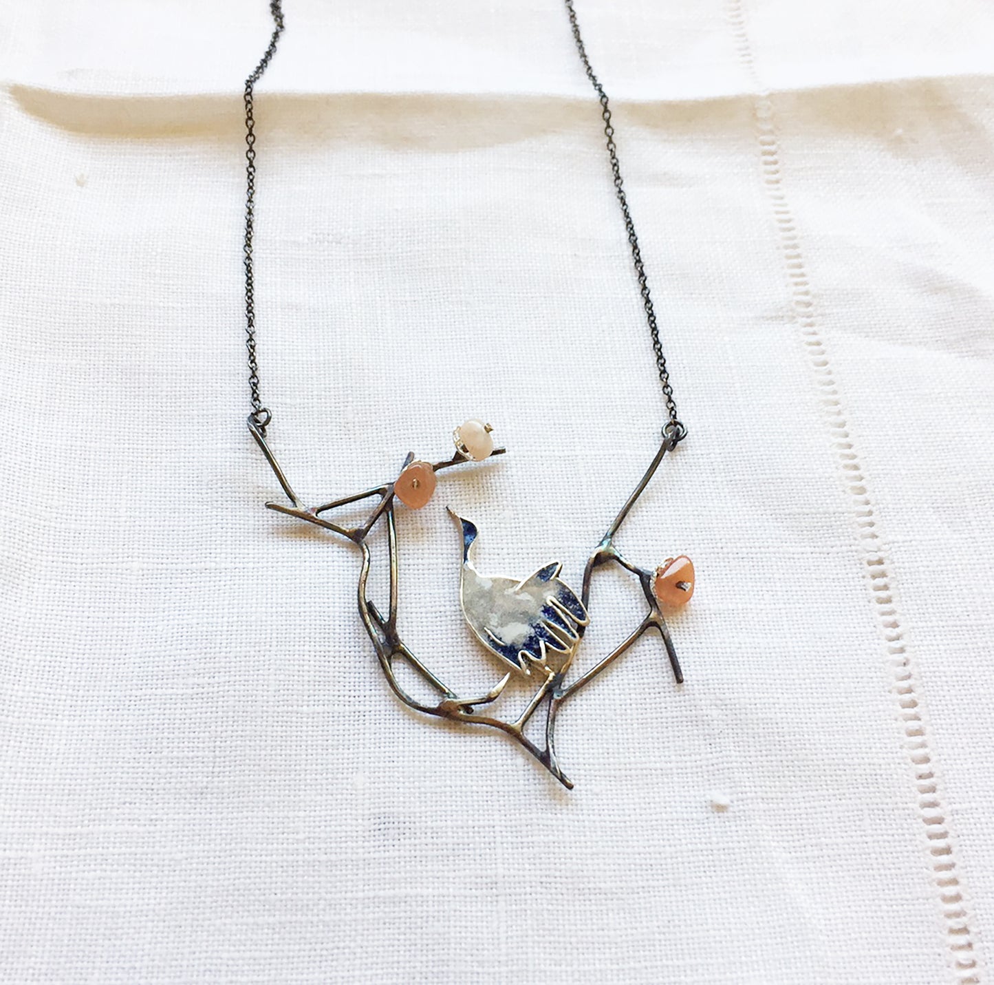 Crane with cherry blossom necklace