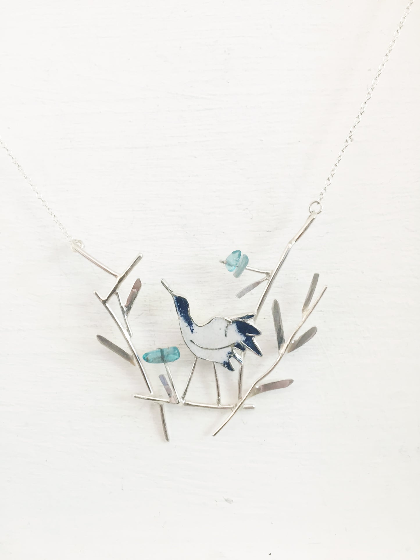 Crane with blue flowers necklace
