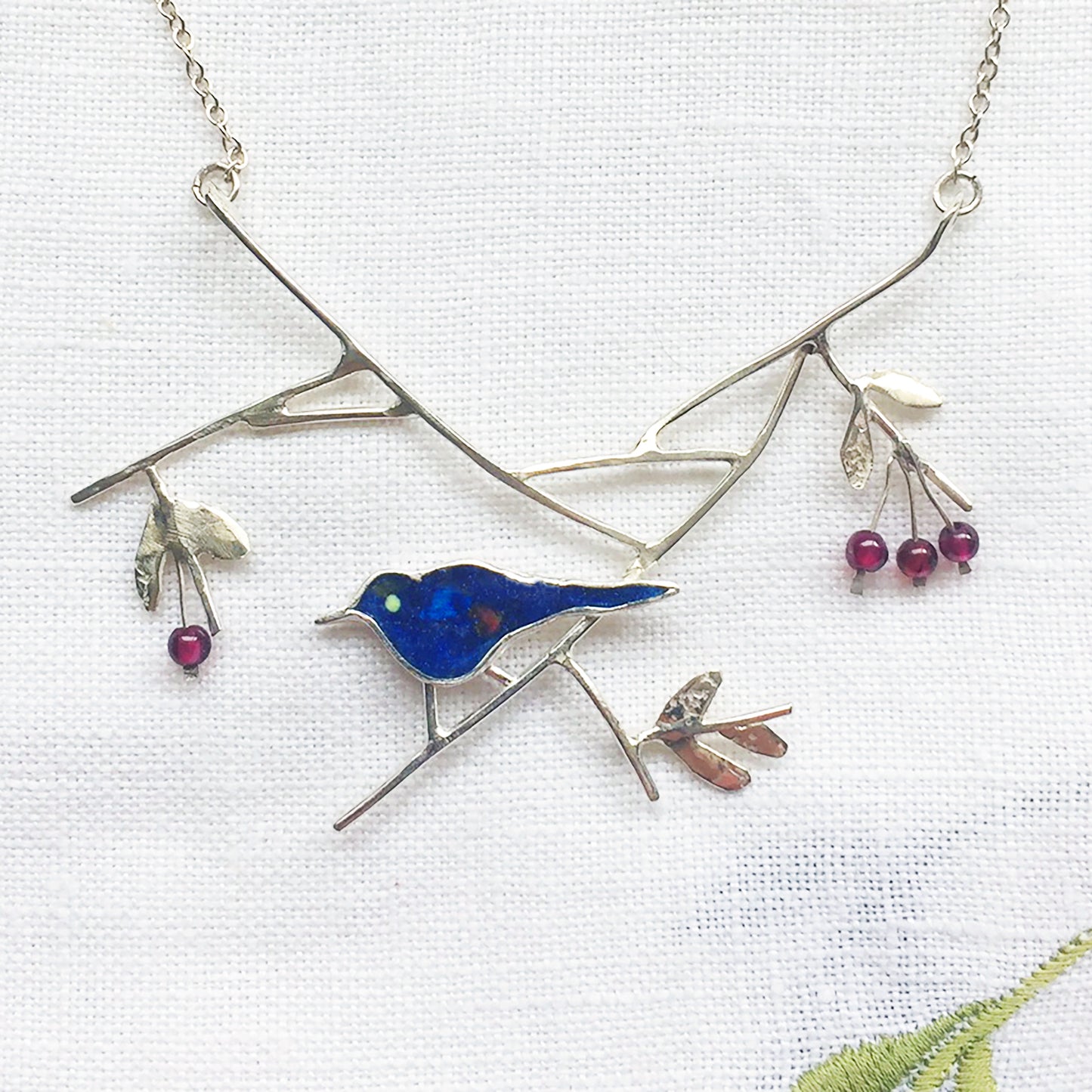 Blackbird with elderberries necklace