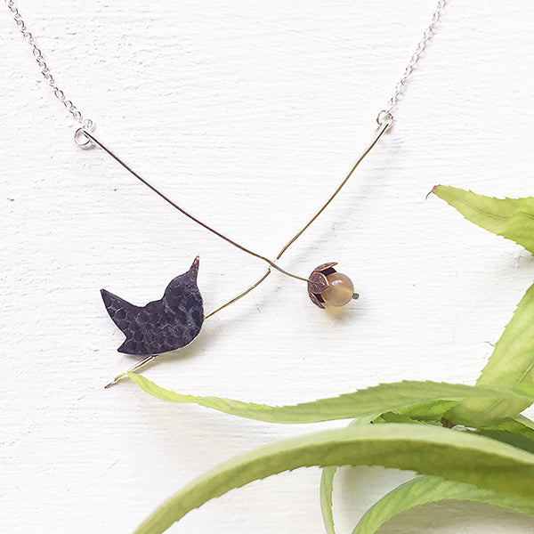 Wren with over ripe apple necklace