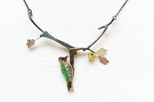 Woodpecker with acorn necklace