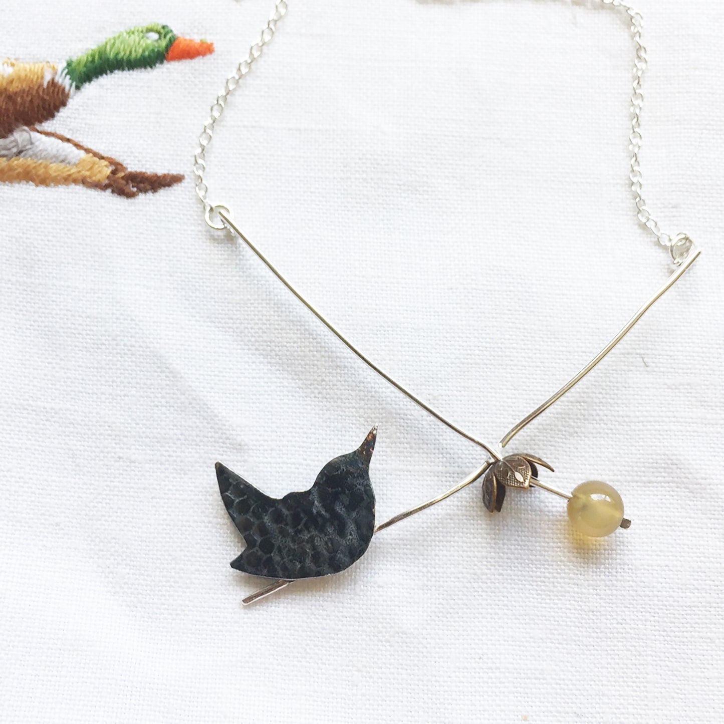 Wren with over ripe apple necklace